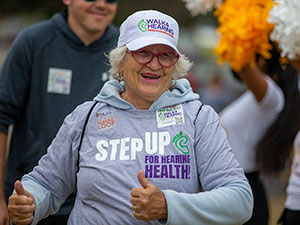 Older woman celebrating outdoors